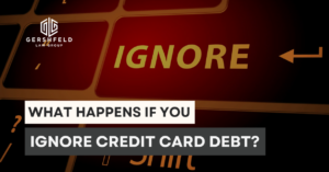Keyboard with the word “IGNORE” highlighted in yellow, symbolizing the dangers of avoiding or neglecting credit card debt.