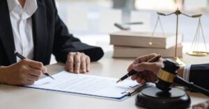 debtor reviewing bills with debt attorney”)