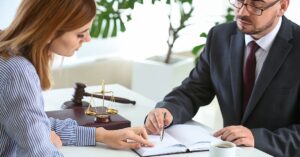 debt attorney discussing debt relief strategies with client”)